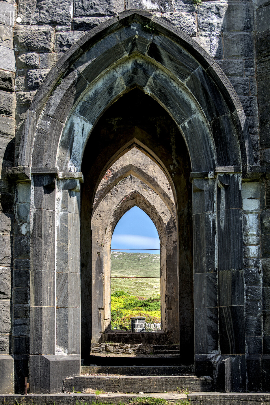 Empty arches of old church in Dún Lúiche, Donegal, Ireland